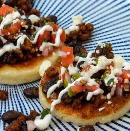 Buttery Arepas with Mexican Chorizo, Black Beans & Crema