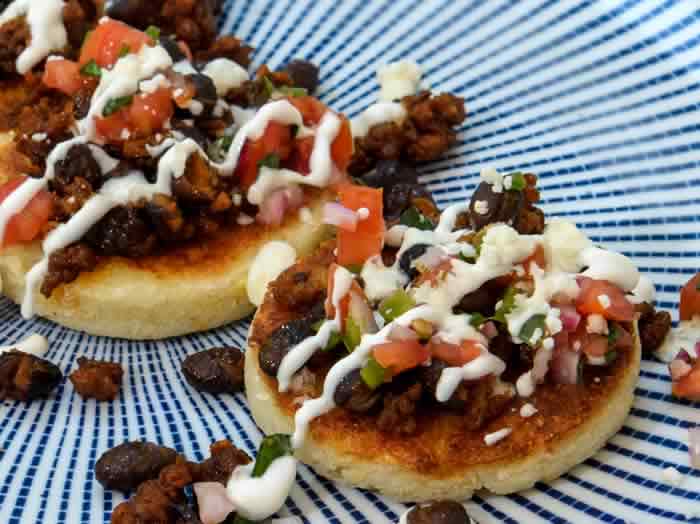 Buttery Arepas with Mexican Chorizo, Black Beans & Crema