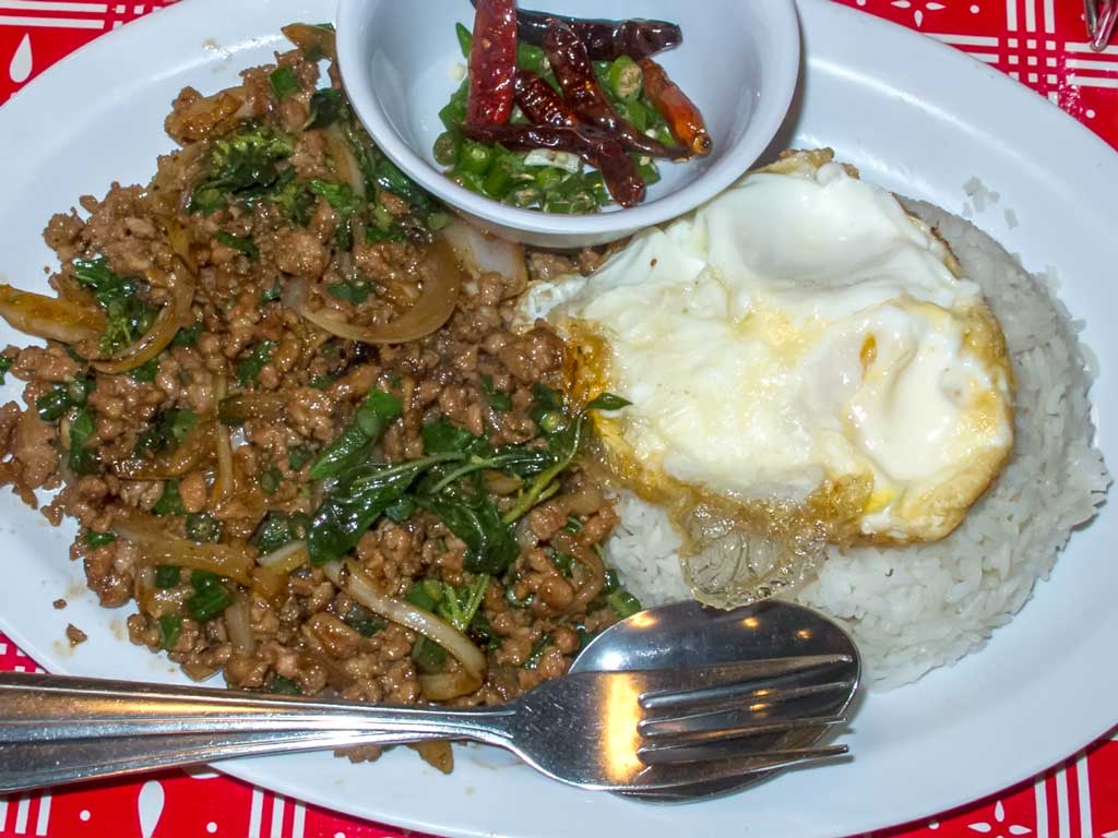 Sen Yai Kai Muu Kaphrao Khai Dao (Spicy fried minced pork and long beans, with onion, Thai basil, and black soy sauce. Served with jasmine rice and a fried egg.)  
