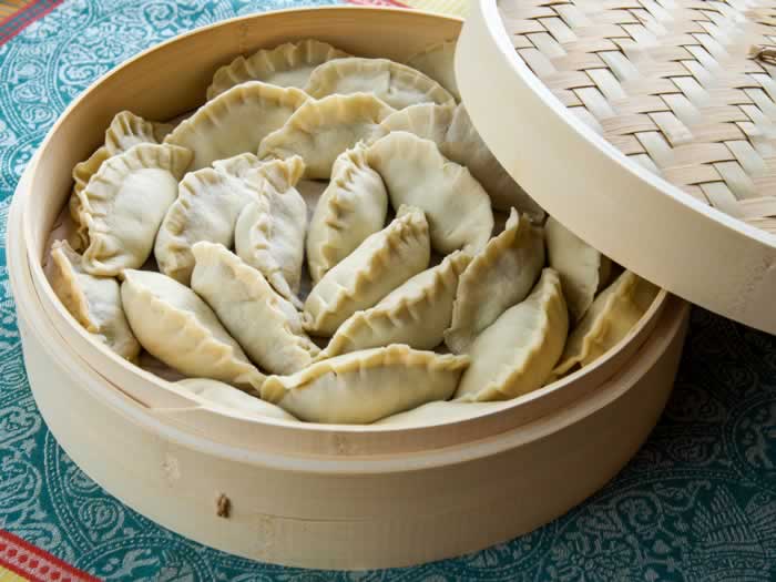 Chinese Bamboo Steamer Filled with Potstickers